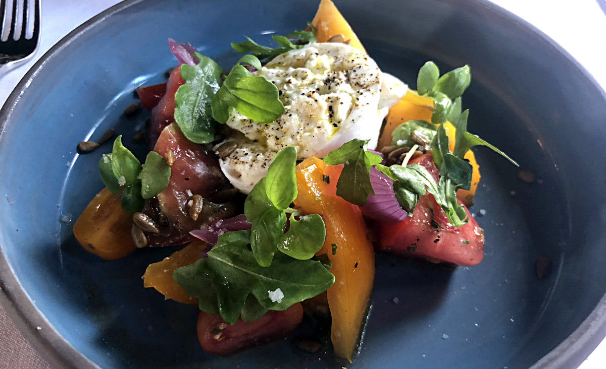 Heirloom tomato salad, burrata, red onion, arugula, basil-sunflower pesto