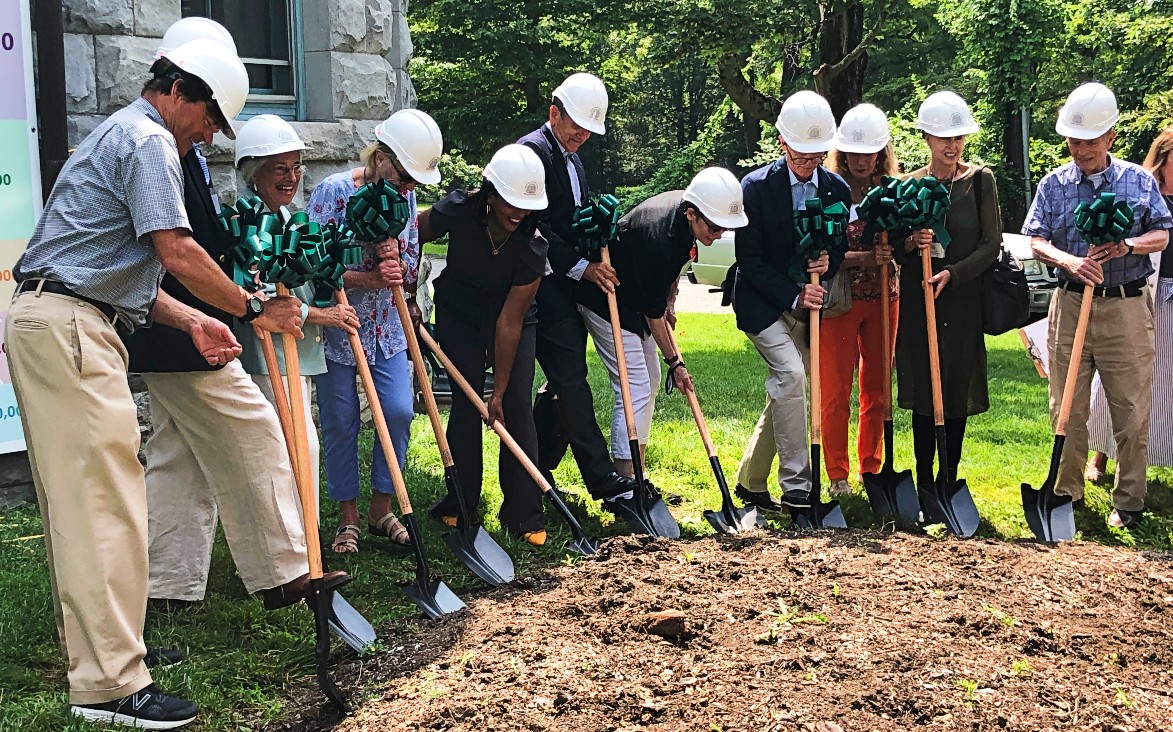 Board and bulding committee members break ground. Board and bulding committee members break ground.