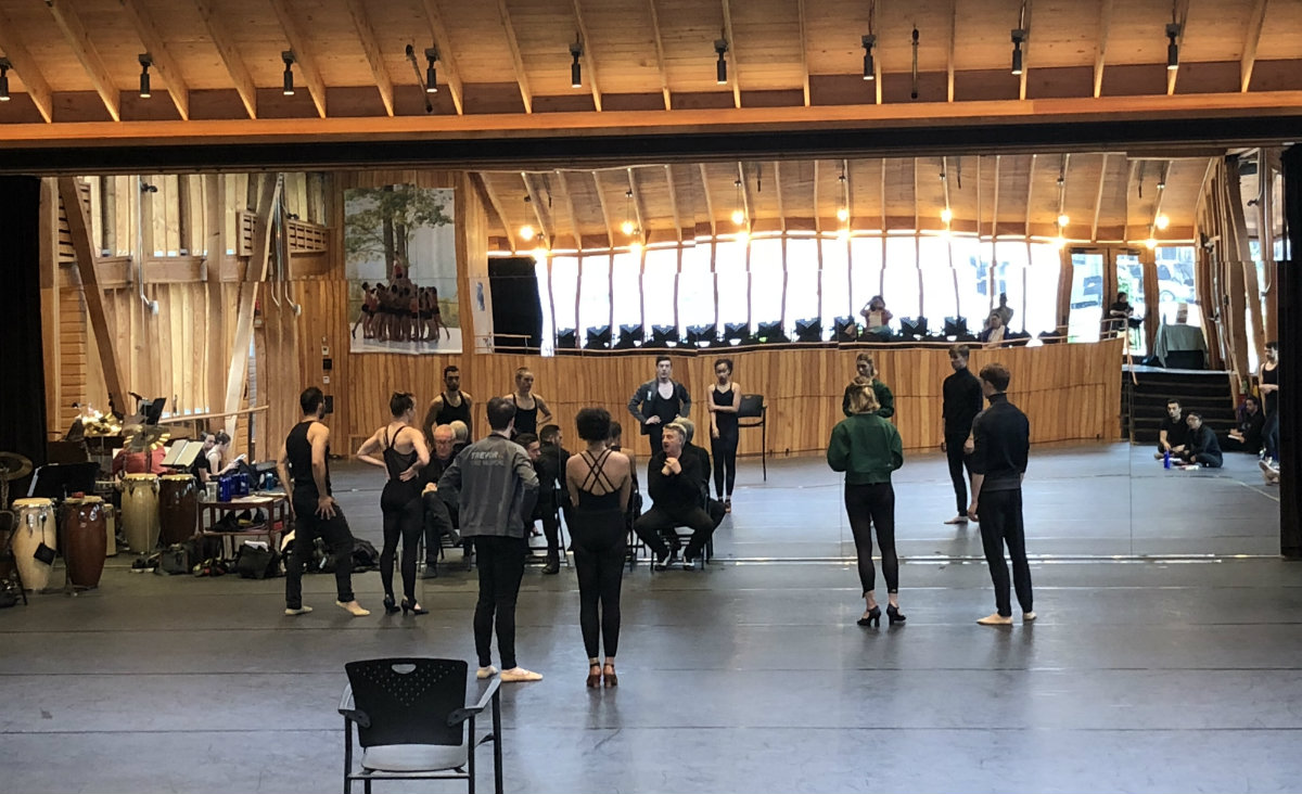 Chet Walker (seated at center) coaches the dancers. Chet Walker (seated at center) coaches the dancers.