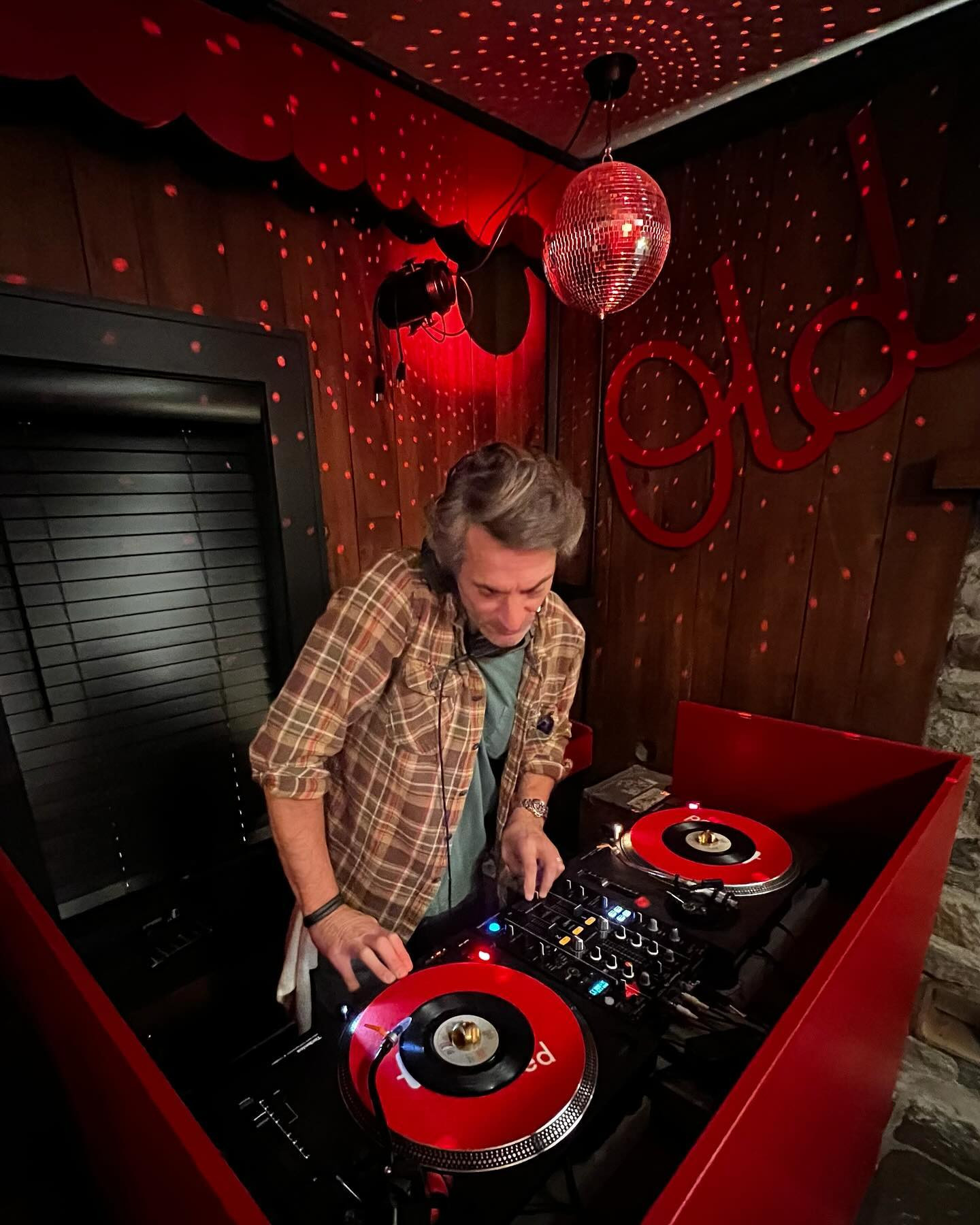 Owner Jack Luber mansthe DJ booth.