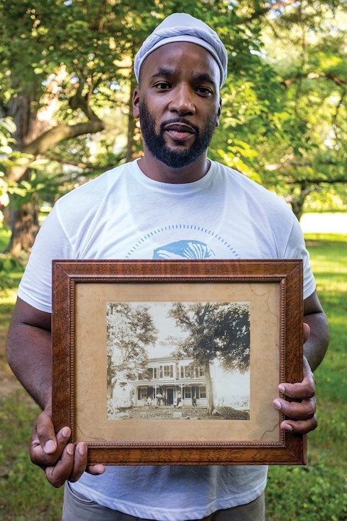Jackson holds a photo of the house from the 19th century. Before he and his wife bought the home in 2015, it had been passed down from the original Dutch settlers through their descendants. The house’s original windows are intact but the covered porch was removed long ago. Jackson holds a photo of the house from the 19th century. Before he and his wife bought the home in 2015, it had been passed down from the original Dutch settlers through their descendants. The house’s original windows are intact but the covered porch was removed long ago.