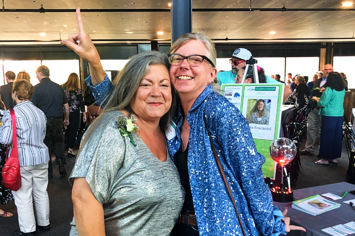 Honoree Liana Toscanini with&nbsp;Ventfort Hall&nbsp;Executive Director Wendy Healey, striking a disco pose in keeping with the event's theme, disco (Liana's request) at the Southern Berkshire Chamber of Commerce Business Person of the Year celebration