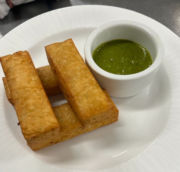 Ligurian panisse with green bagna cauda, from the Cichetti menu Ligurian panisse with green bagna cauda, from the Cichetti menu