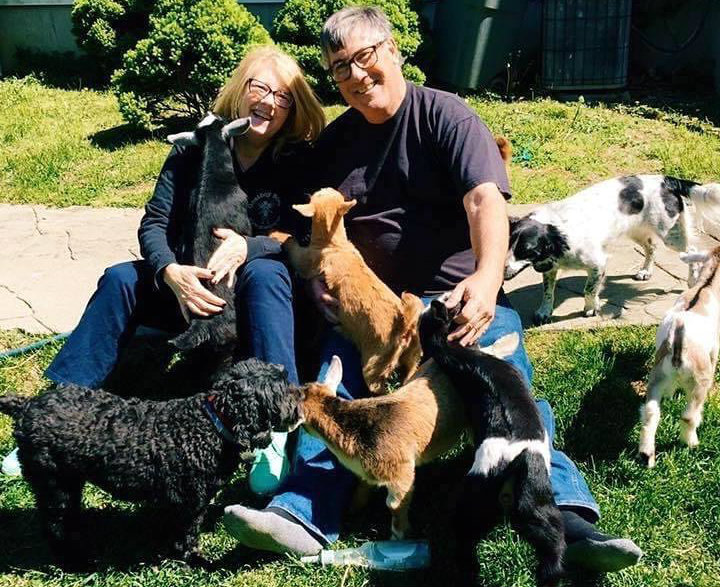 Lisa and Rick Agee with a pile of animals. Lisa and Rick Agee with a pile of animals.
