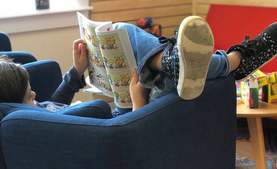 Reading, not texting, after school at Megabrain Comics