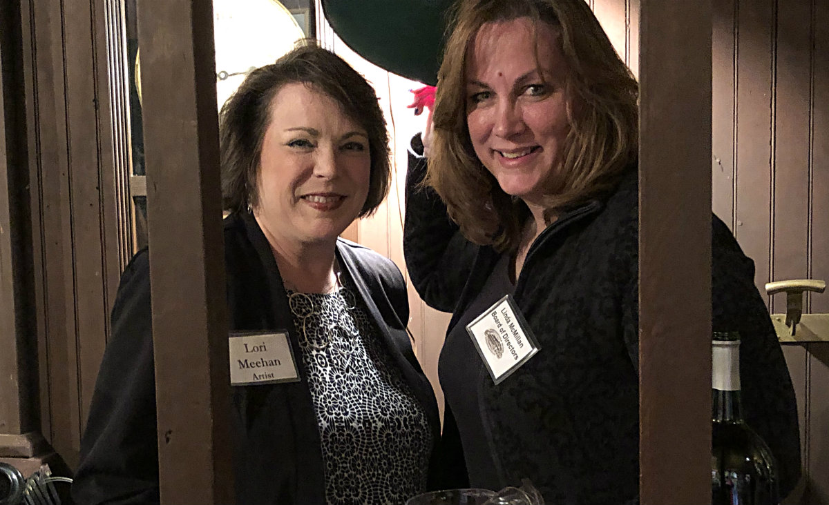 Board members Lori Meehan and Linda McMillan, bartenders for the evening
