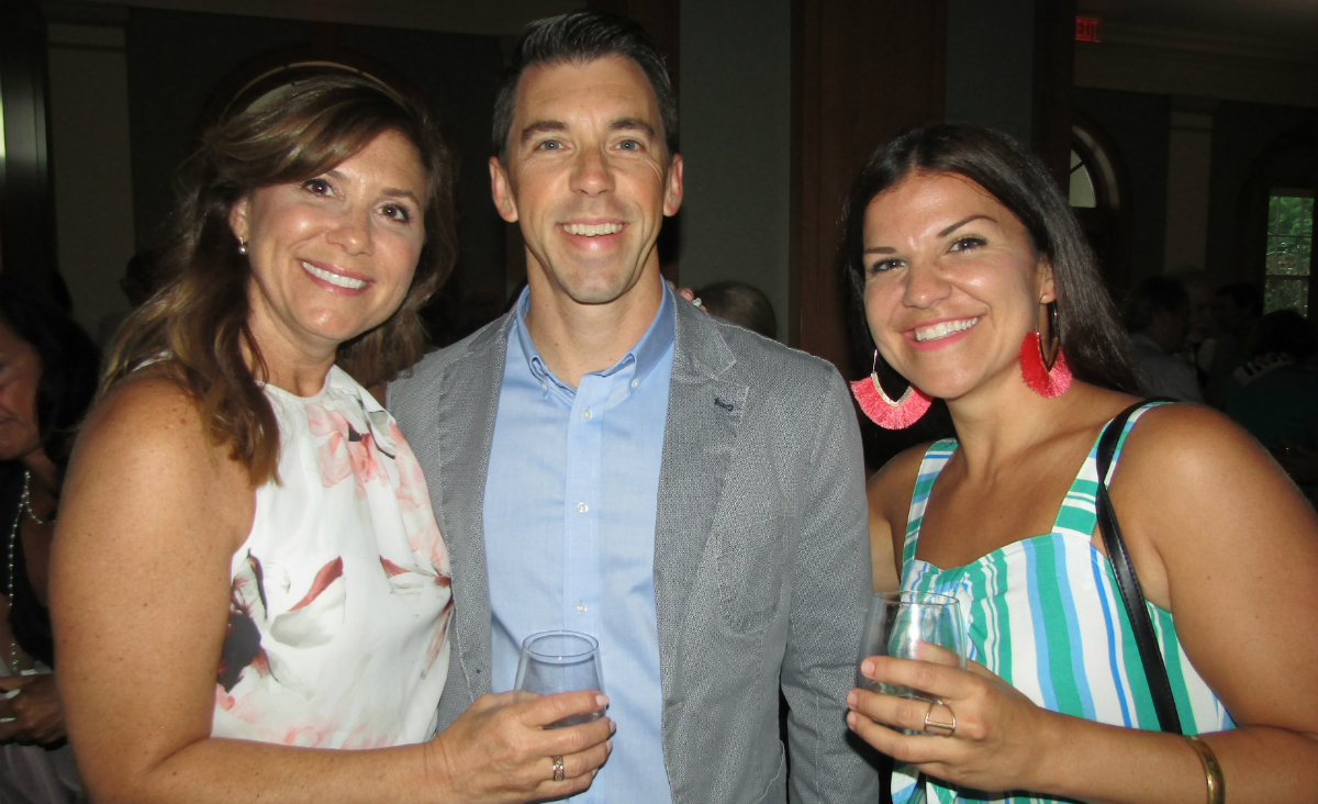 Proud parents Randi and Ryan Beckley, who came from California to watch their son Wyatt perform, pose with MIC Program Director Marisa Massery