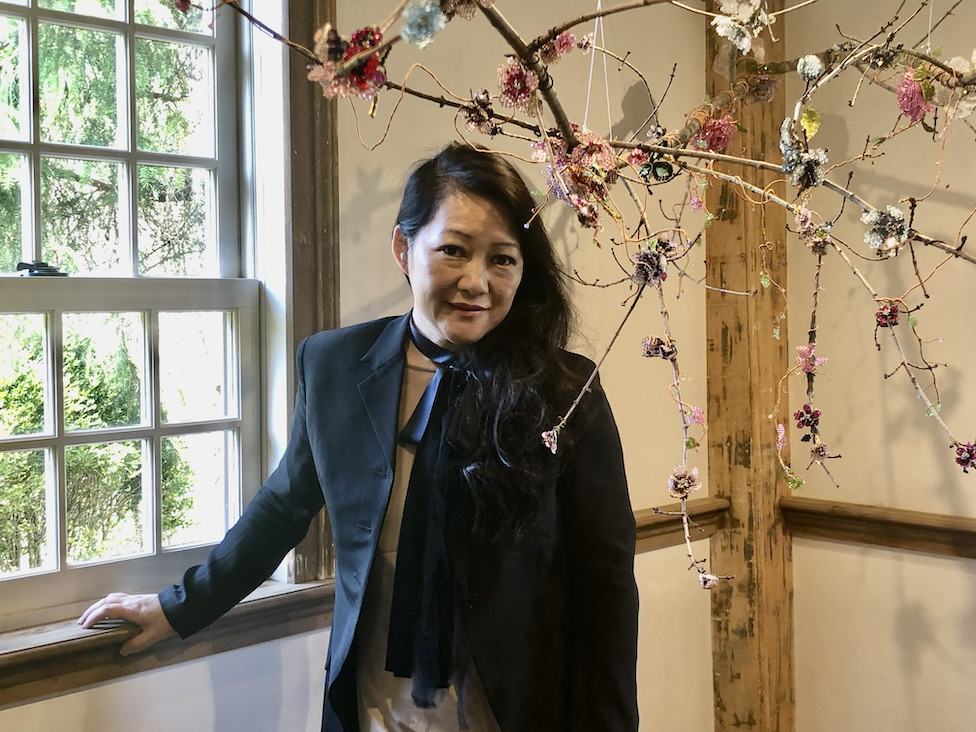 Lam beside the branches decorated with spring jewels