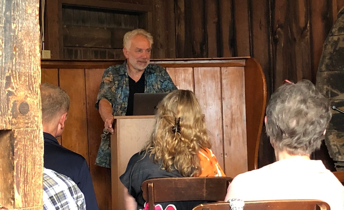 While reading, Epstein peered through the window of the barn towards the Melville house. "It's very intimidating to have his ghost behind me," he said.