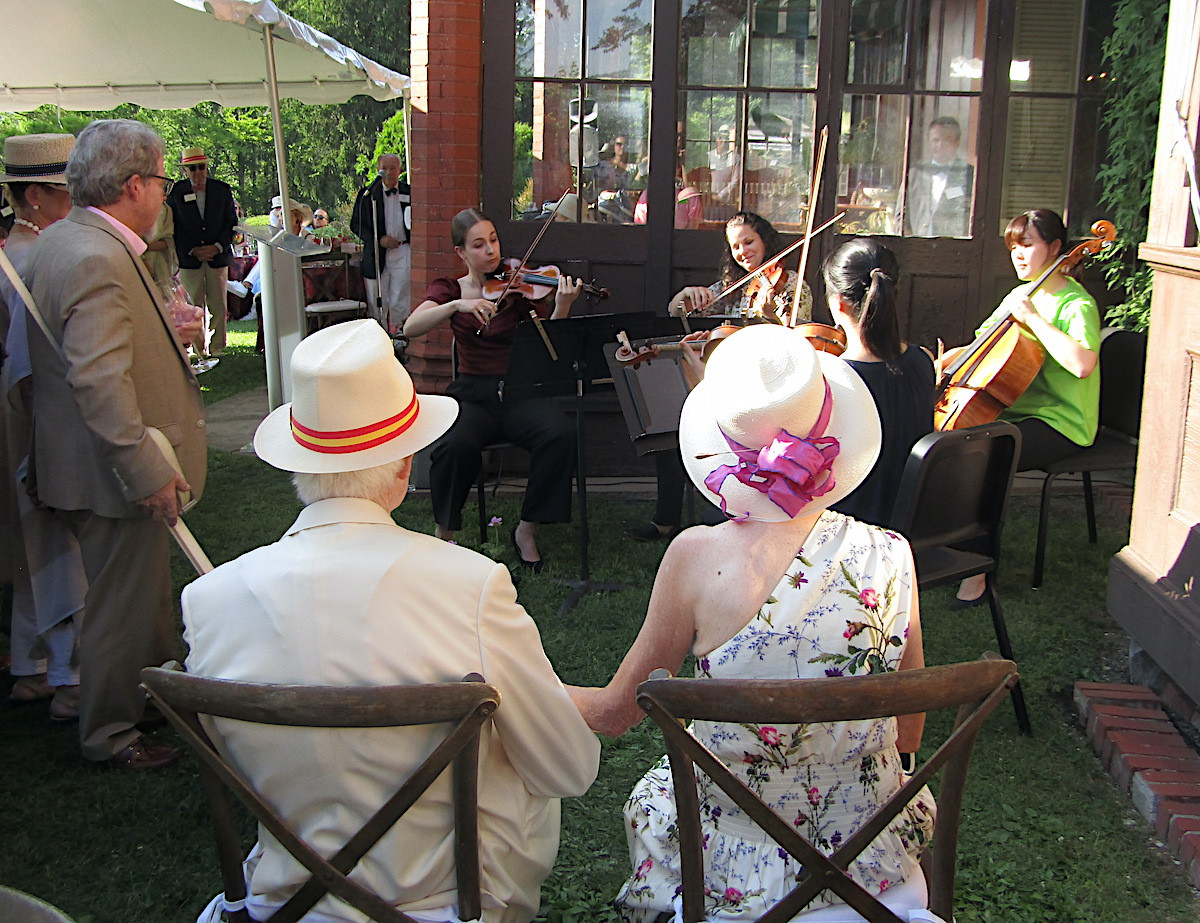 The evening's honorees, Nathan and Marilyn Hayward, enjoy a pop-up surprised performance from a Tanglewood quartet.