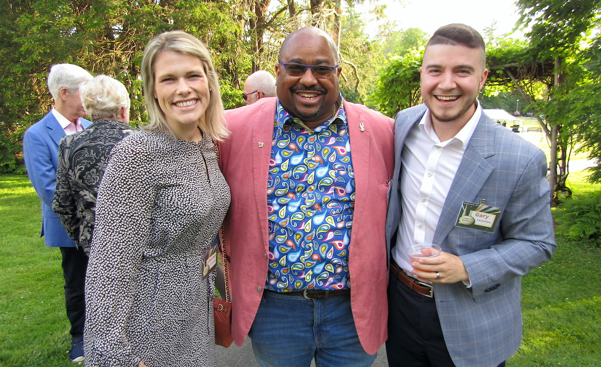 Warren Dews Jr. is flanked by Lauren Lavariere and Gary Lavariere, a member of the gala committee.