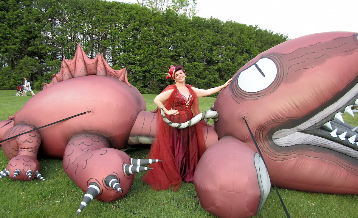 Krysten Marche poses with her outfit inspiration, Morton the Sea Monster.