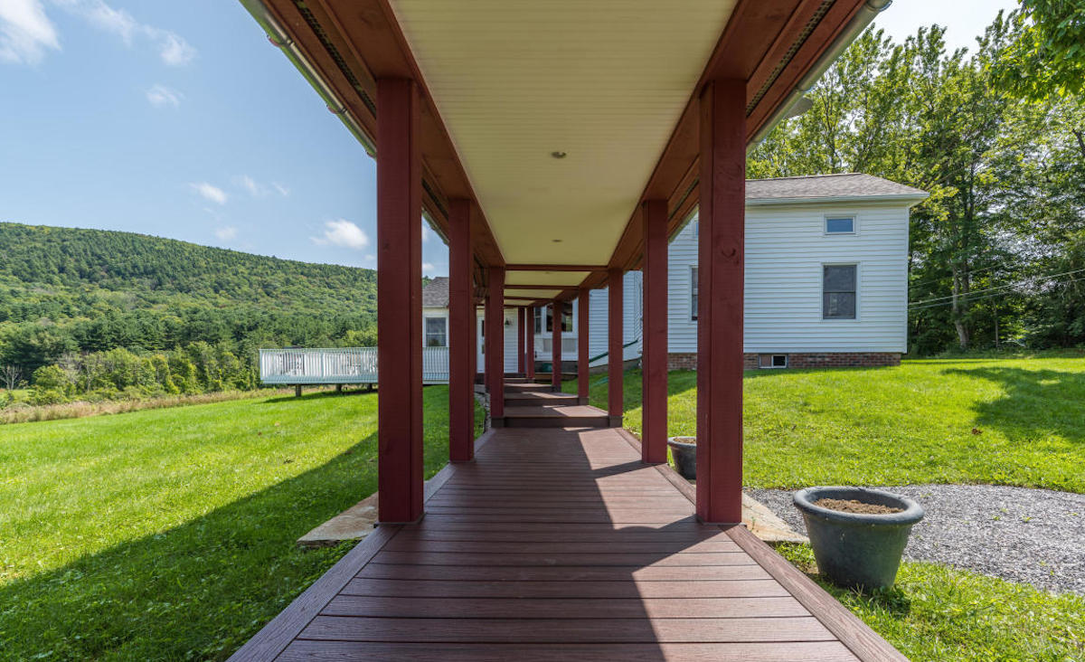 Covered walkway leading to farmhouse