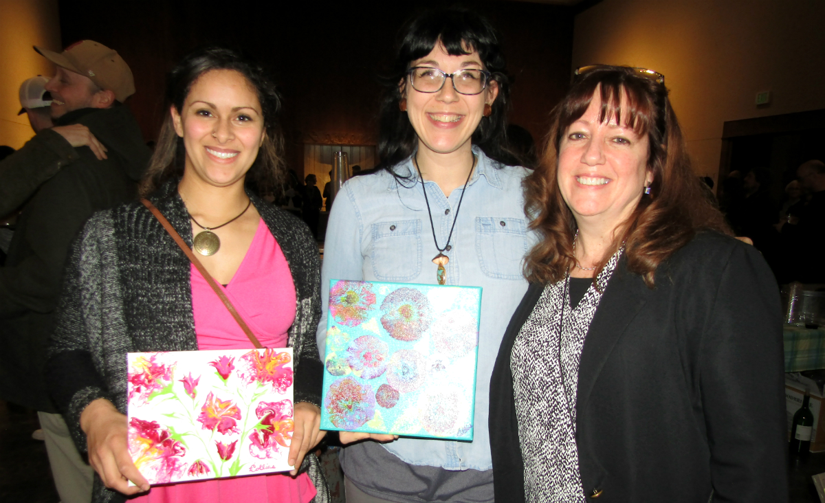 Kristie Hartig and Colleen Cambell chose paintings by, and posed with, artist Irene Collias Kristie Hartig and Colleen Cambell chose paintings by, and posed with, artist Irene Collias 