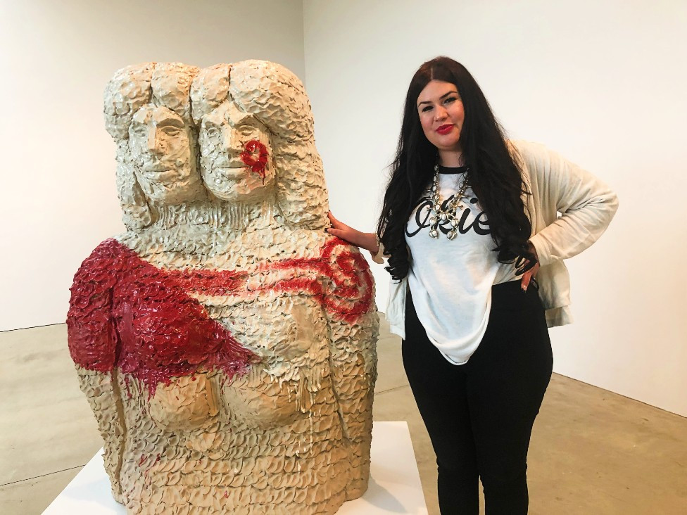 Raven Halfmoon, the artist, stands beside her work&nbsp;Bah'hatteno Ina (Red River Mother), 2022