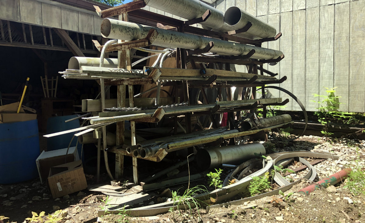 Raw materials are stacked up at the back of Butler's workshop. - Lisa Green