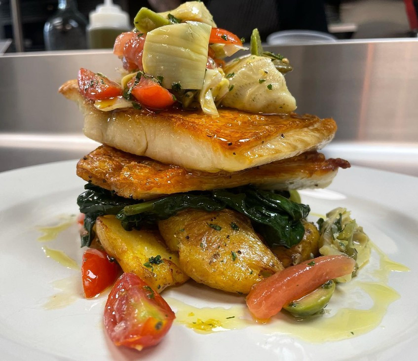 One night's special:&nbsp;Red snapper with lemon, capers, Castelvetrano olives and artichoke over spinach and fingerling potatoes