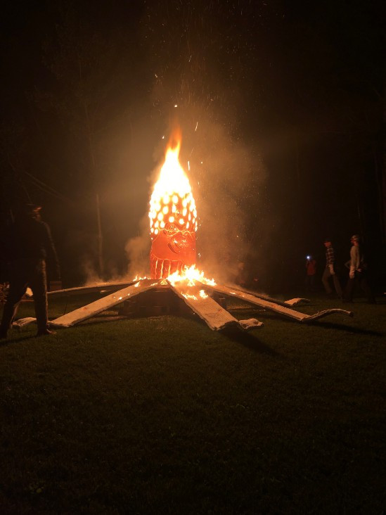A fiery sculpture, with embers flying A fiery sculpture, with embers flying