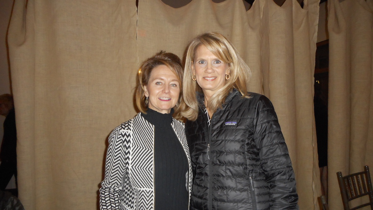 Ellen House, a member of the board of directors, and Theresa Smith of Mystique Salon