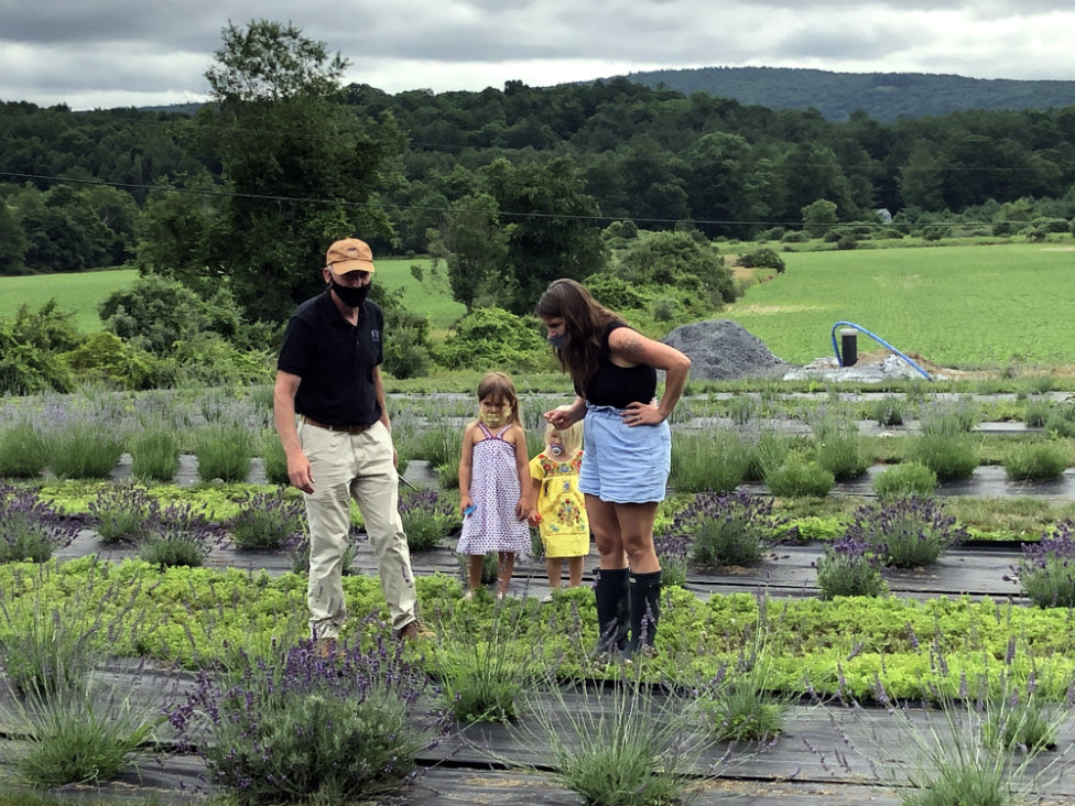 Ron Reinken educates a mom and her kids about lavender.