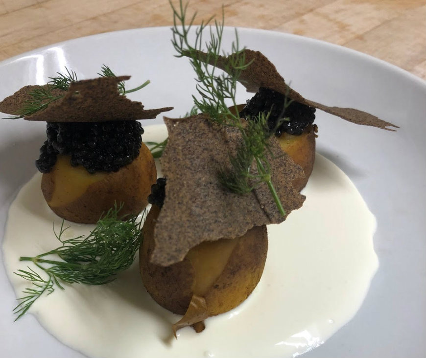 Caviar and&nbsp;smoked potato with buckwheat tuile and creme fraiche