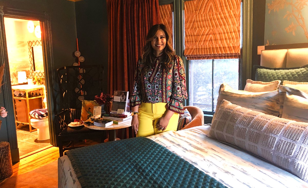 Rydhima Brar, with roots in India and Kuwait, created "The Empress's Quarters," using rich jewel tones, hand-painted panoramic wallpaper, and luxurious natural stone. Rydhima Brar, with roots in India and Kuwait, created "The Empress's Quarters," using rich jewel tones, hand-painted panoramic wallpaper, and luxurious natural stone.