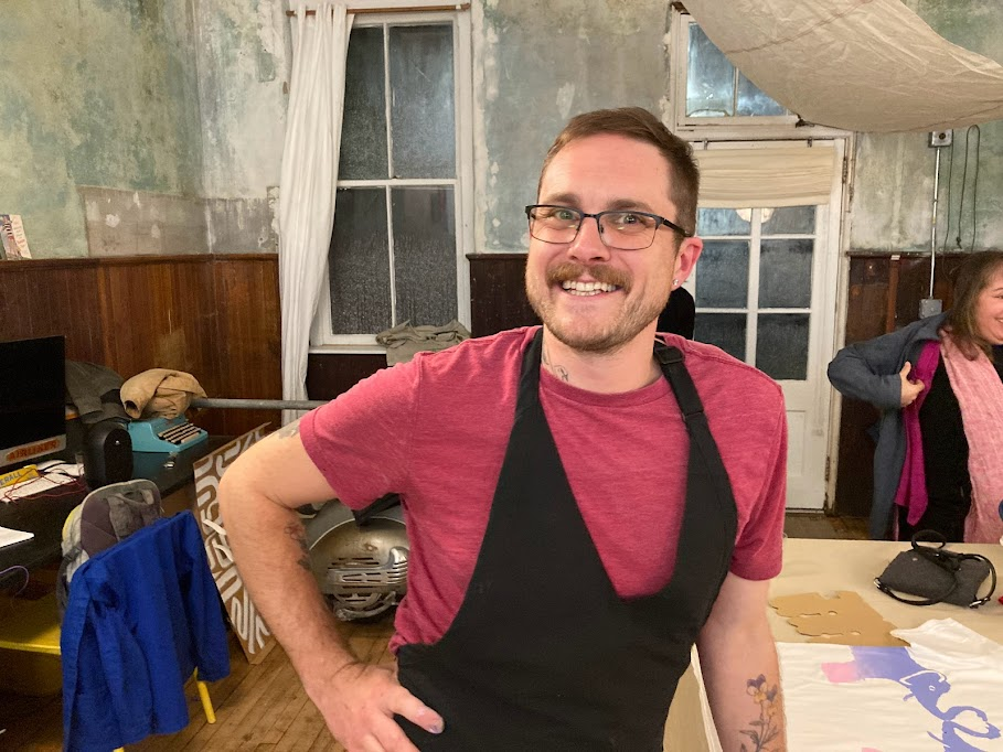 Scotty Salame&nbsp;assists in the silk screening fun at the&nbsp;40th anniversary event at Bon Dimanche in Great Barrington. Salame is a former camper turned working artist; he remains an educator with the nonprofit. Photo credit: Hannah Van Sickle