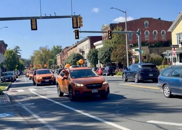 Sunshine Orange Crosstrek Parade: Great Barrington's Unexpected Spectacle