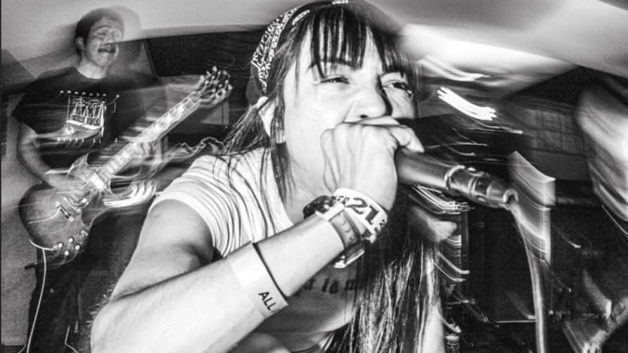 photograph of the band performing live