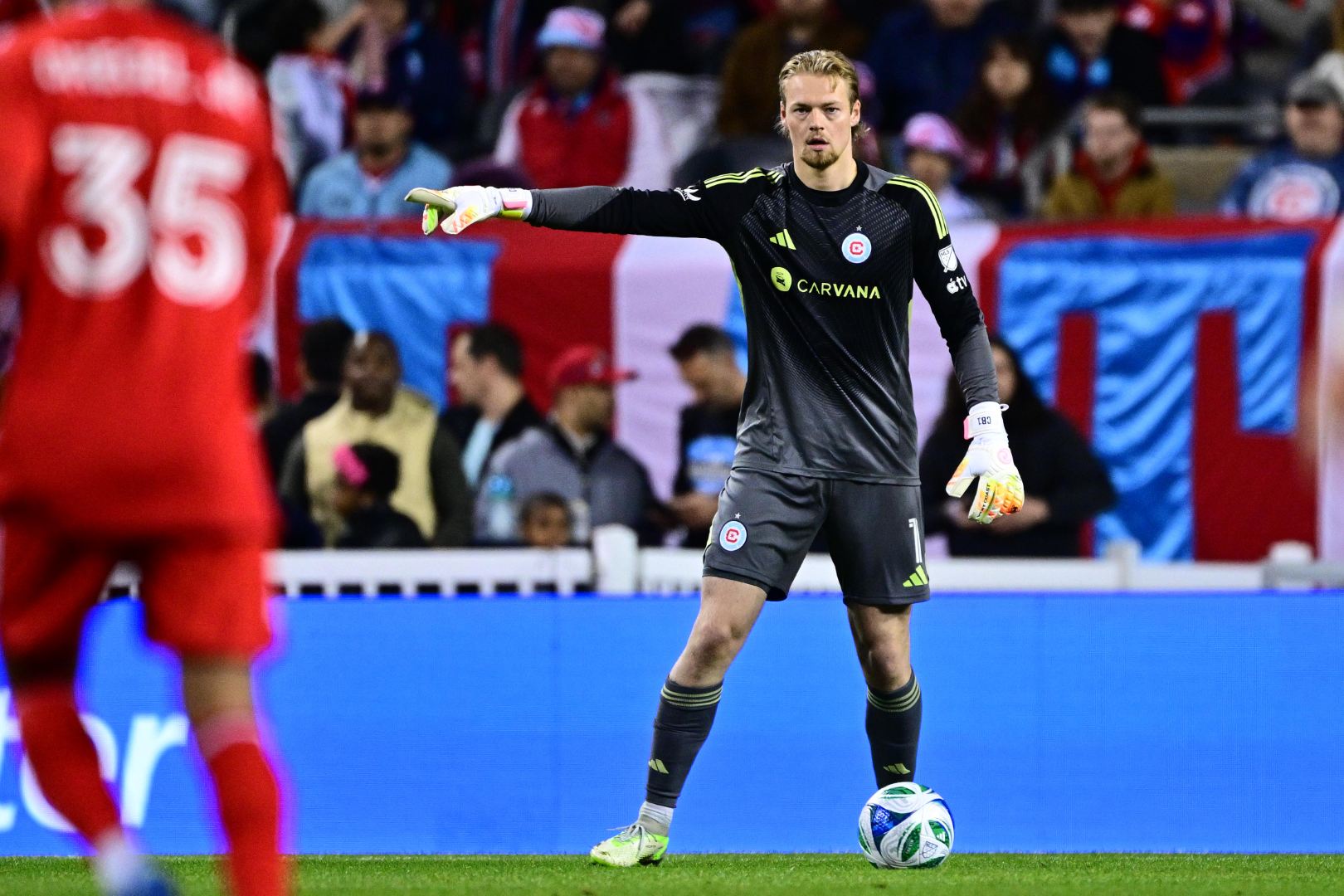 Chris Brady directs other players during the Fire's match against FC Cincinnati on April 19, 2025.