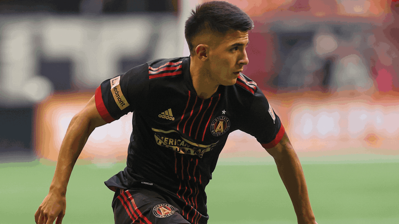 Thiago Almada plays the ball during a soccer game 