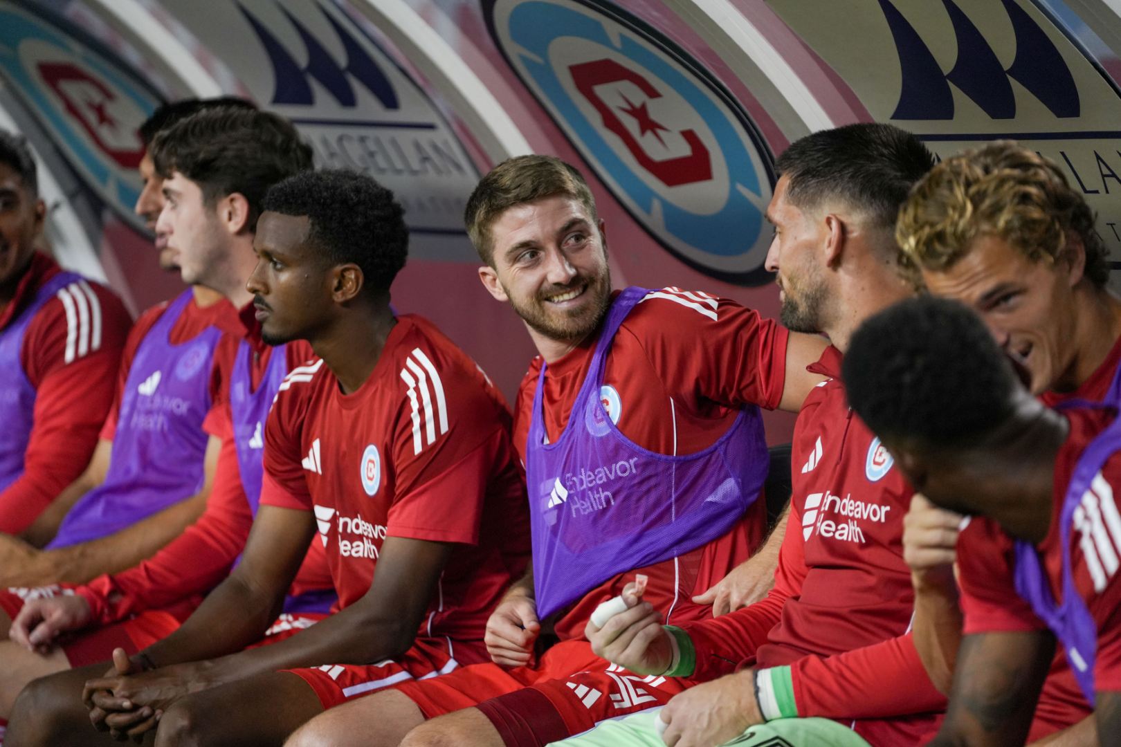 Players including Brian Gutiérrez, Maren Haile-Selassie, Jonathan Dean, and Jeff Gal on the bench during the Fire's game against the Columbus Crew on September 27, 2025.