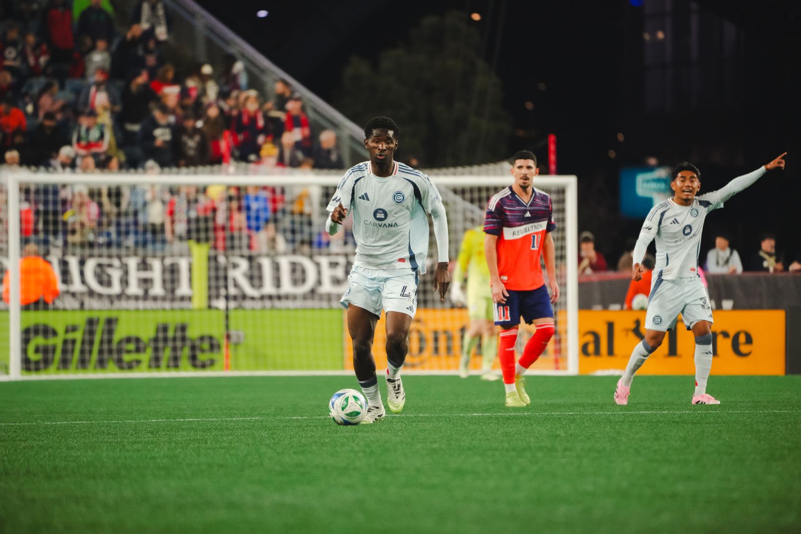 Djé D'Avilla plays the ball for the Chicago Fire during their game against the New England Revolution on October 18, 2025