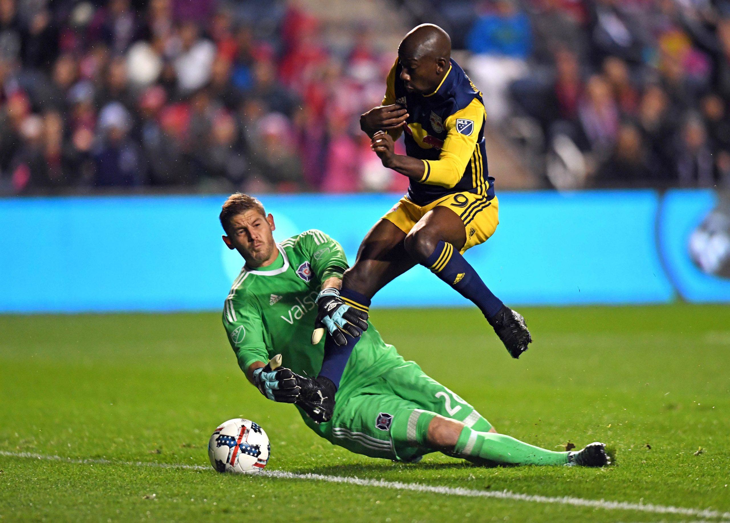 Oct 25, 2017; Chicago, IL, USA; New York Red Bulls forward Bradley Wright-Phillips (99) scores a goal against Chicago Fire goalkeeper Matt Lampson (28) during the first half of an Eastern Conference knockout round soccer game at Toyota Park. Mandatory Credit: Patrick Gorski-USA TODAY Sports