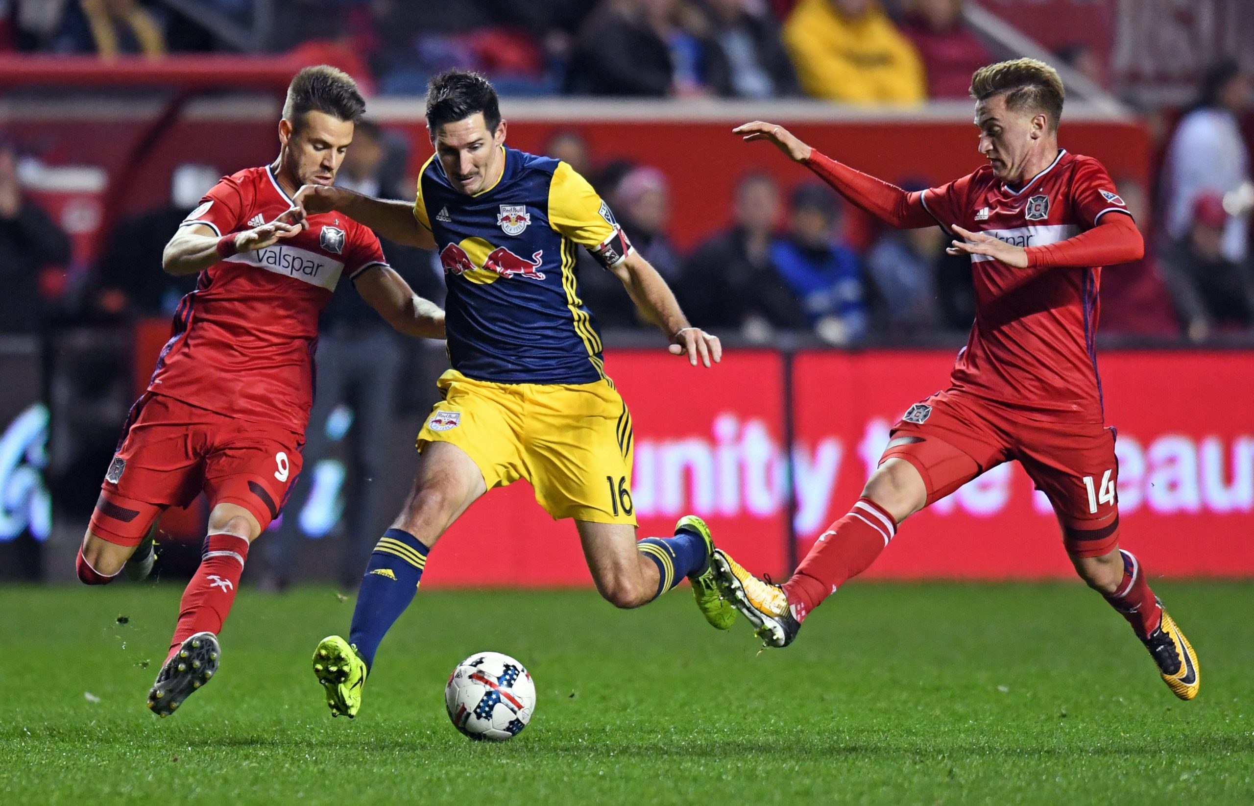 Oct 25, 2017; Chicago, IL, USA; New York Red Bulls midfielder Sacha Kljestan (16) controls the ball against Chicago Fire forward Luis Solignac (left) and midfielder Djordje Mihailovic (right) during the first half of an Eastern Conference knockout round soccer game at Toyota Park. Mandatory Credit: Patrick Gorski-USA TODAY Sports