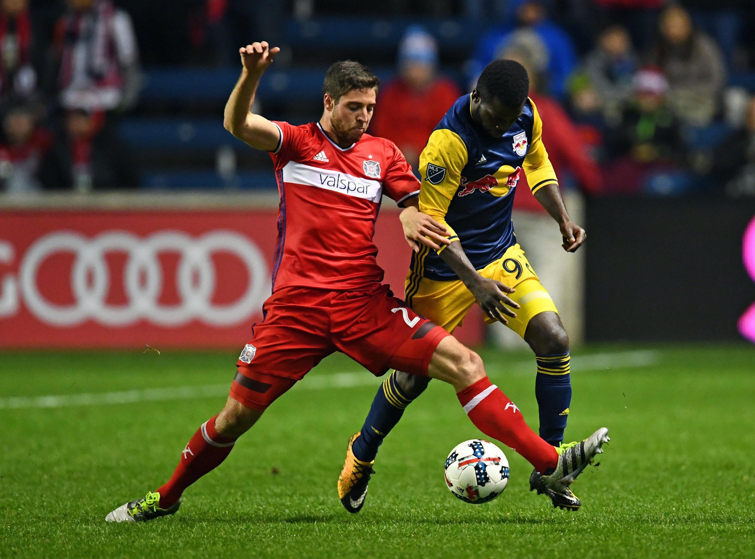 Oct 25, 2017; Chicago, IL, USA; Chicago Fire defender Matt Polster (2) steals the ball from New York Red Bulls defender Kemar Lawrence (92) during the second half at Toyota Park. Mandatory Credit: Mike DiNovo-USA TODAY Sports