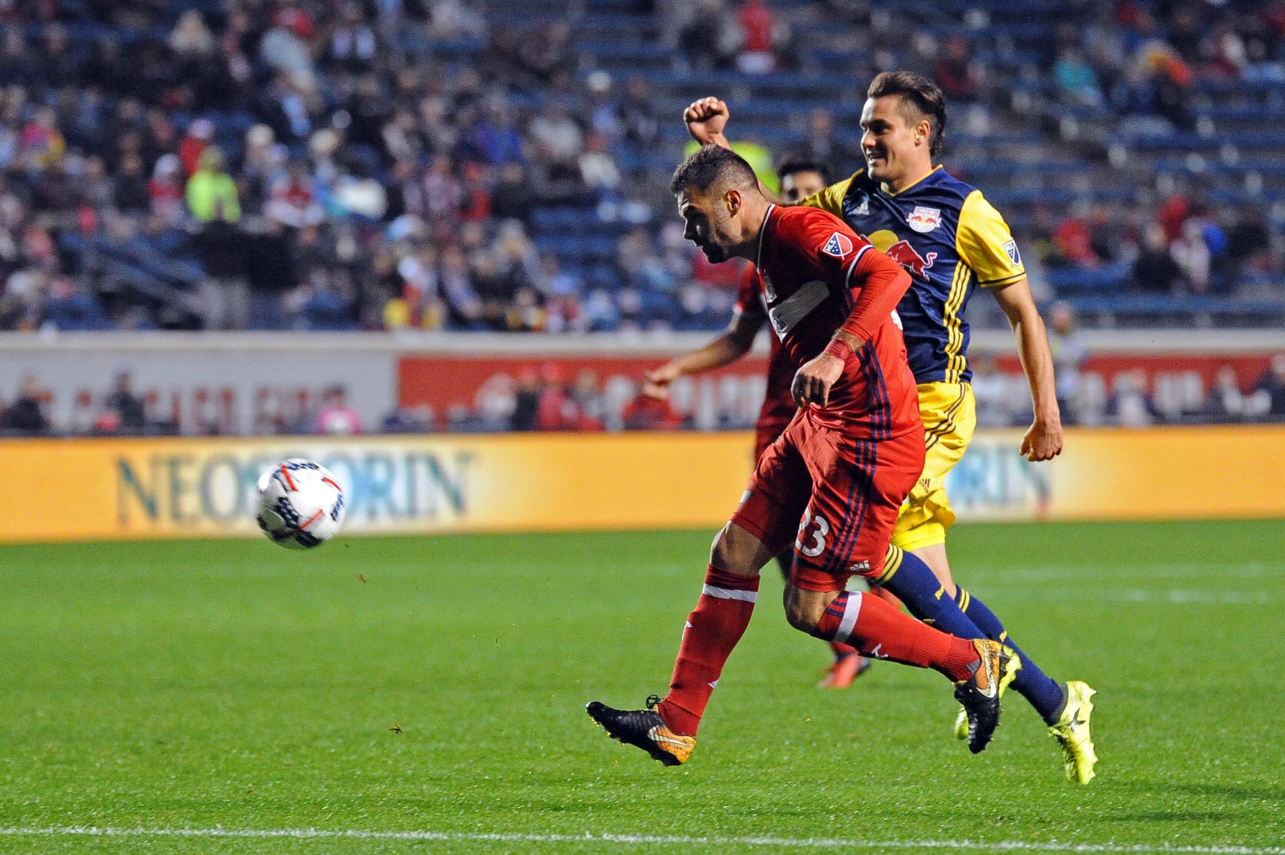 Oct 25, 2017; Chicago, IL, USA; Chicago Fire forward Nemanja Nikolic (23) attempts a shot against New York Red Bulls defender Aaron Long (right) during the second half of an Eastern Conference knockout round soccer game at Toyota Park. Red Bulls won 4-0. Mandatory Credit: Patrick Gorski-USA TODAY Sports