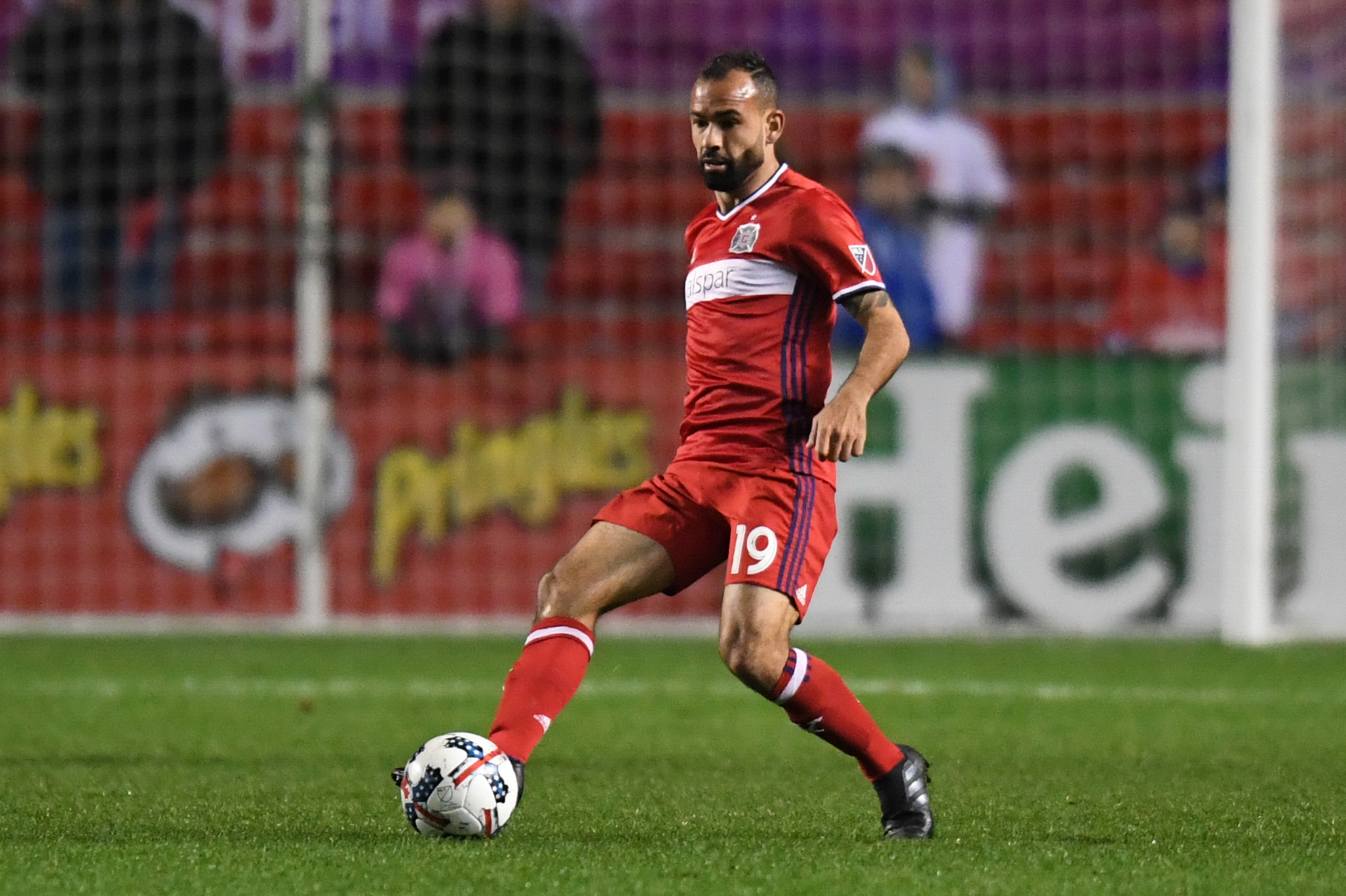 Oct 25, 2017; Chicago, IL, USA; Chicago Fire midfielder Juninho (19) passes the ball against the New York Red Bulls during an Eastern Conference knockout round soccer game at Toyota Park. Red Bulls won 4-0. Mandatory Credit: Patrick Gorski-USA TODAY Sports