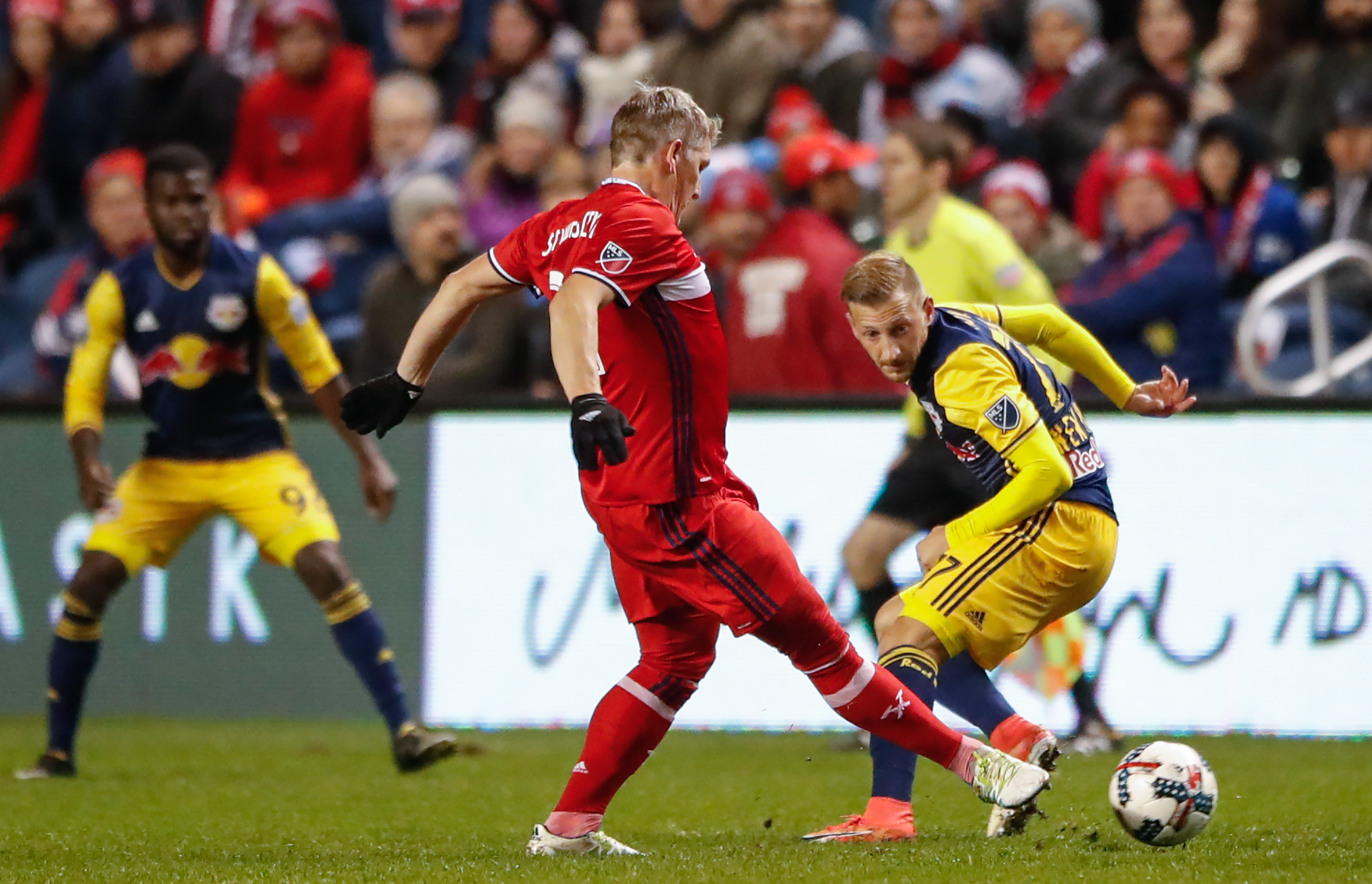 Oct 25, 2017; Chicago, IL, USA; Chicago Fire midfielder Bastian Schweinsteiger (31) passes the ball against New York Red Bulls midfielder Daniel Royer (77) during the second half at Toyota Park. Mandatory Credit: Kamil Krzaczynski-USA TODAY Sports