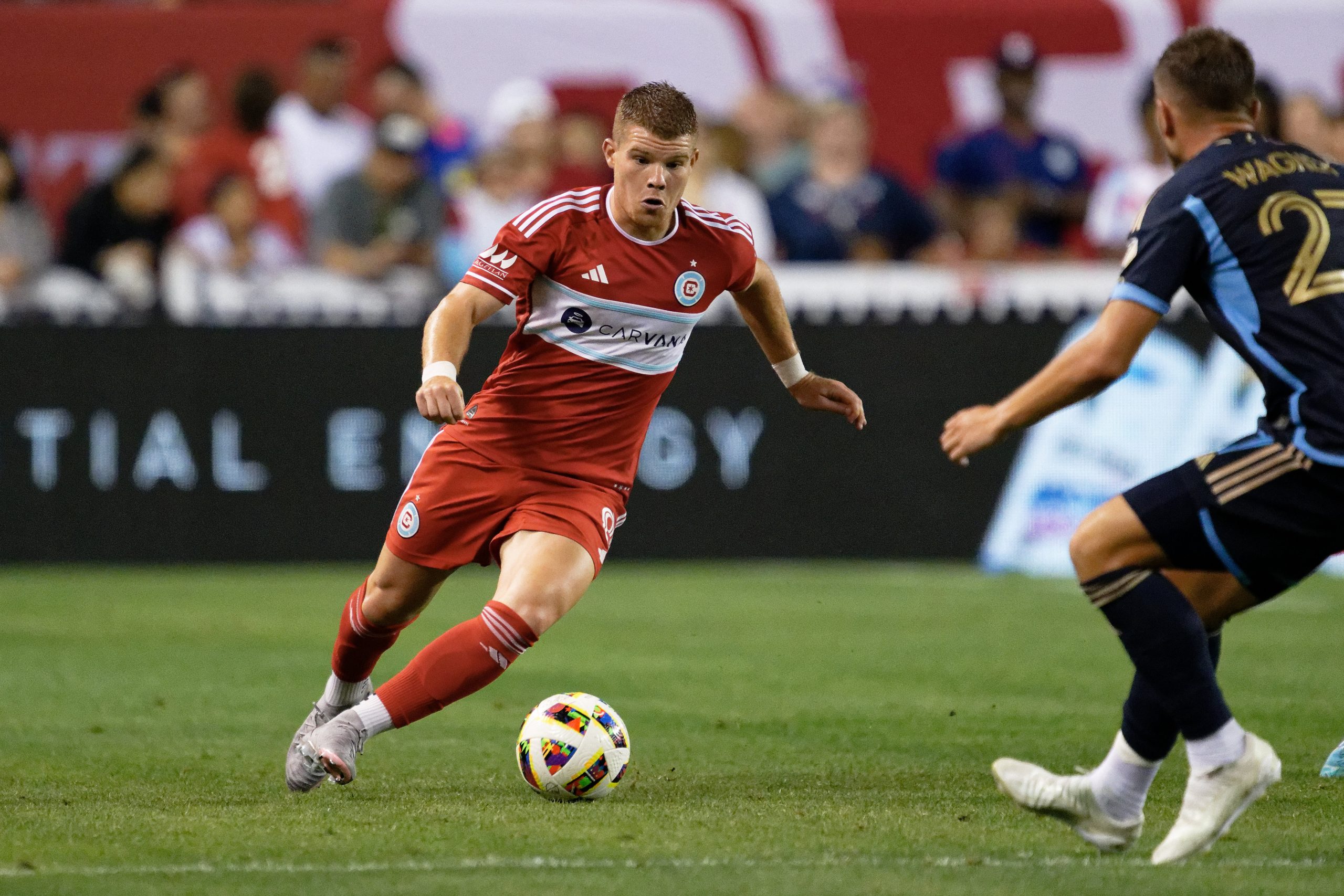 Jul 3, 2024; Chicago, Illinois, USA;  Chicago Fire FC forward Chris Mueller (8) controls the ball against the Philadelphia Union at Soldier Field. Mandatory Credit: Jamie Sabau-USA TODAY Sports