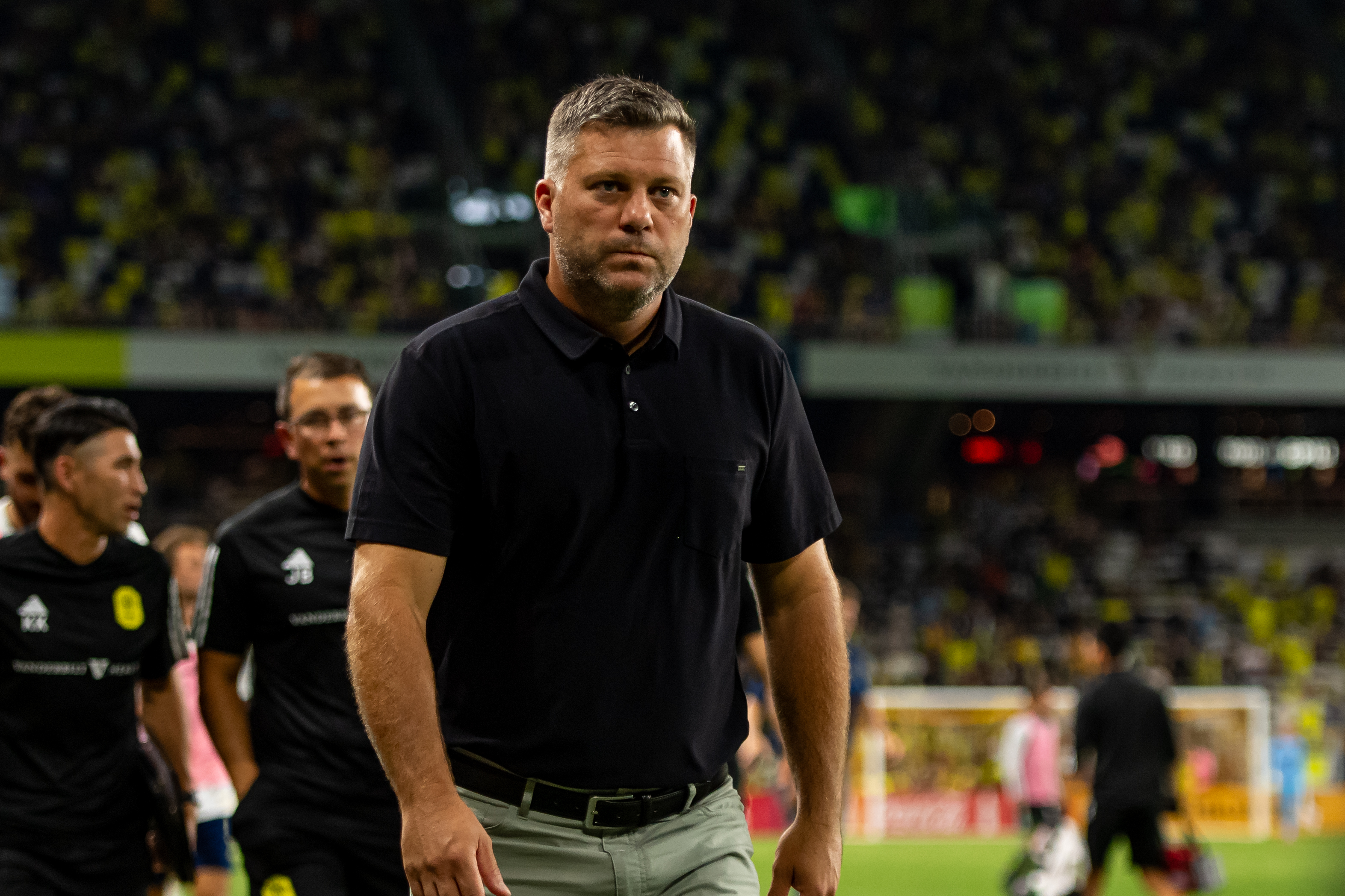 Aug 24, 2024; Nashville, Tennessee, USA;  Nashville SC head coach B.J. Callaghan walks off the field at the end of the first half against the Austin FC during the first half at Geodis Park.