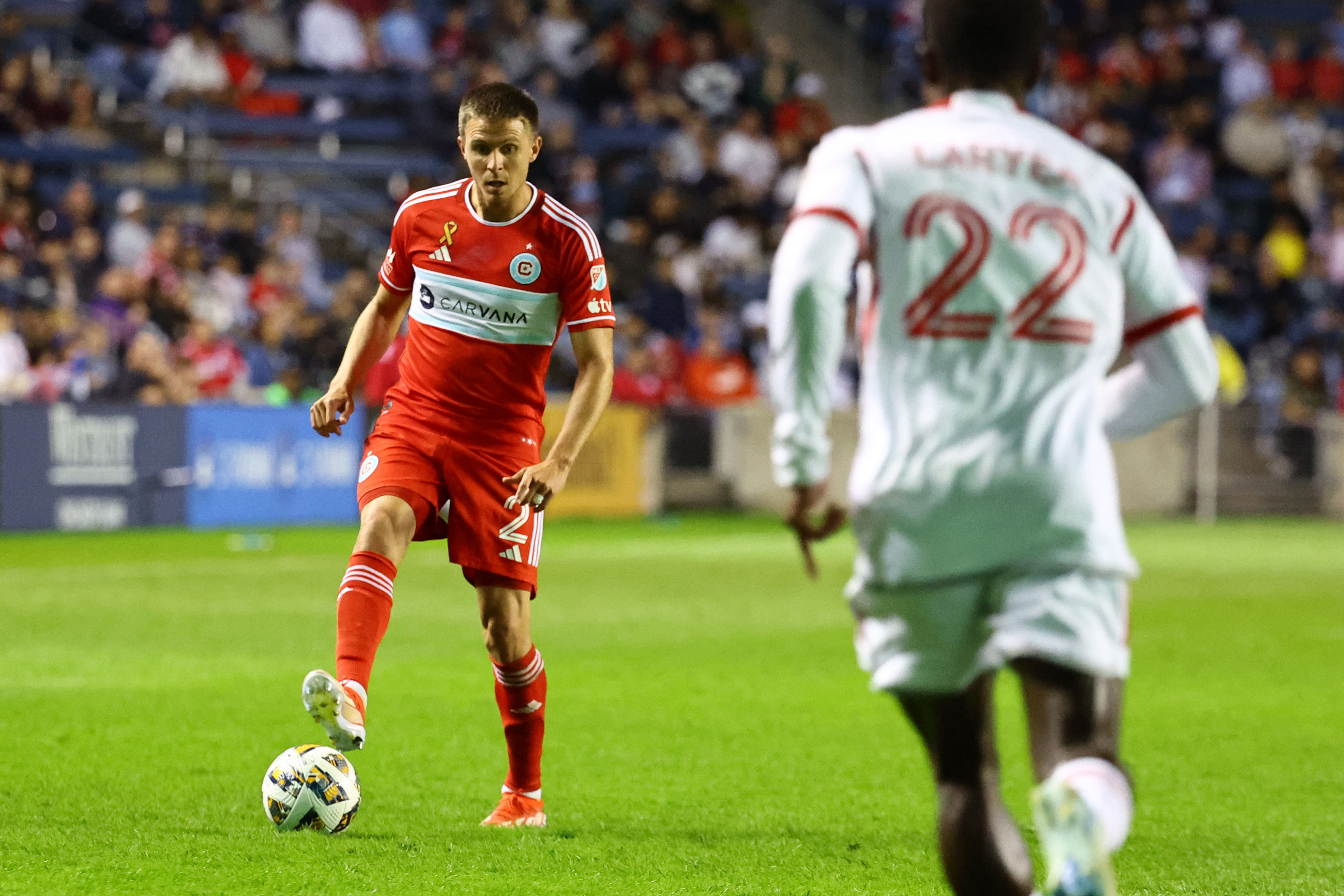 Sep 28, 2024; Chicago, Illinois, USA; Chicago Fire FC defender Arnaud Souquet (2) kicks the ball against Toronto FC during the first half of the game at SeatGeek Stadium. 