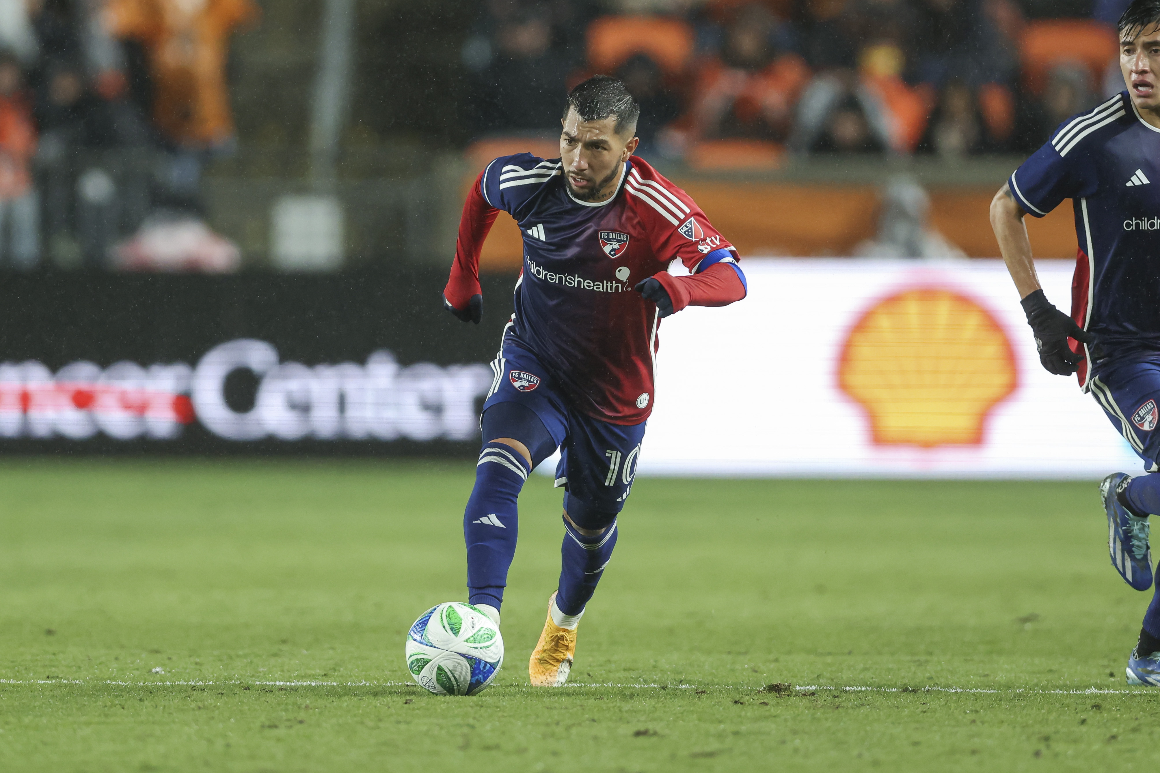 Feb 22, 2025; Houston, Texas, USA; FC Dallas forward Luciano Acosta (10) in action during the match against Houston Dynamo FC at Shell Energy Stadium. 