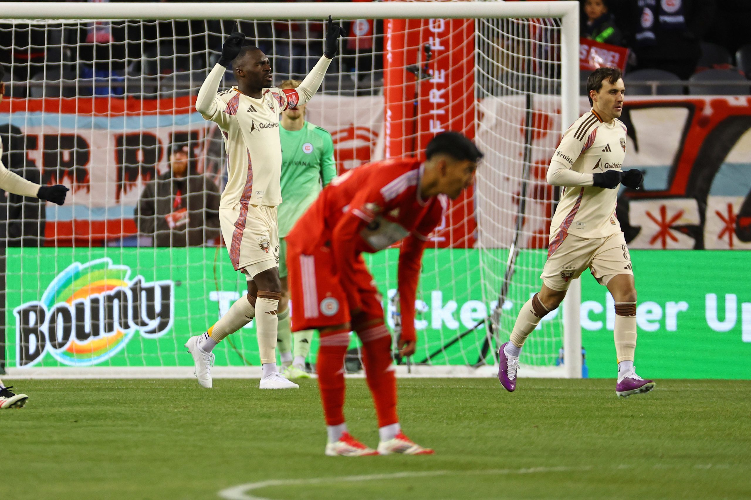 Mar 1, 2025; Chicago, Illinois, USA; D.C. United forward Christian Benteke (20) reacts after scoring a goal against Chicago Fire FC during the first half at Soldier Field