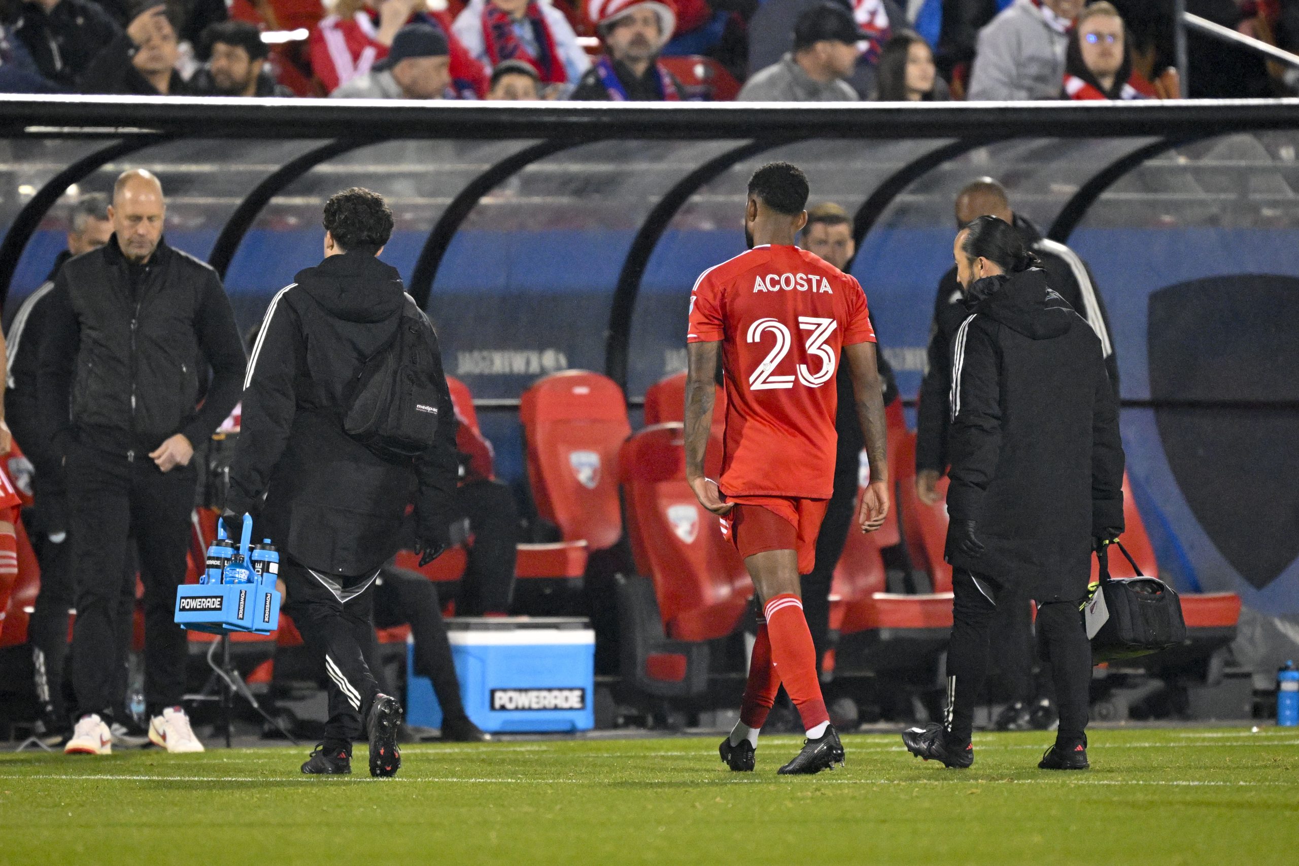 Mar 8, 2025; Frisco, Texas, USA; Chicago Fire midfielder Kellyn Acosta (23) leaves the game with an apparent injury during the first half against FC Dallas at Toyota Stadium. Mandatory Credit: 