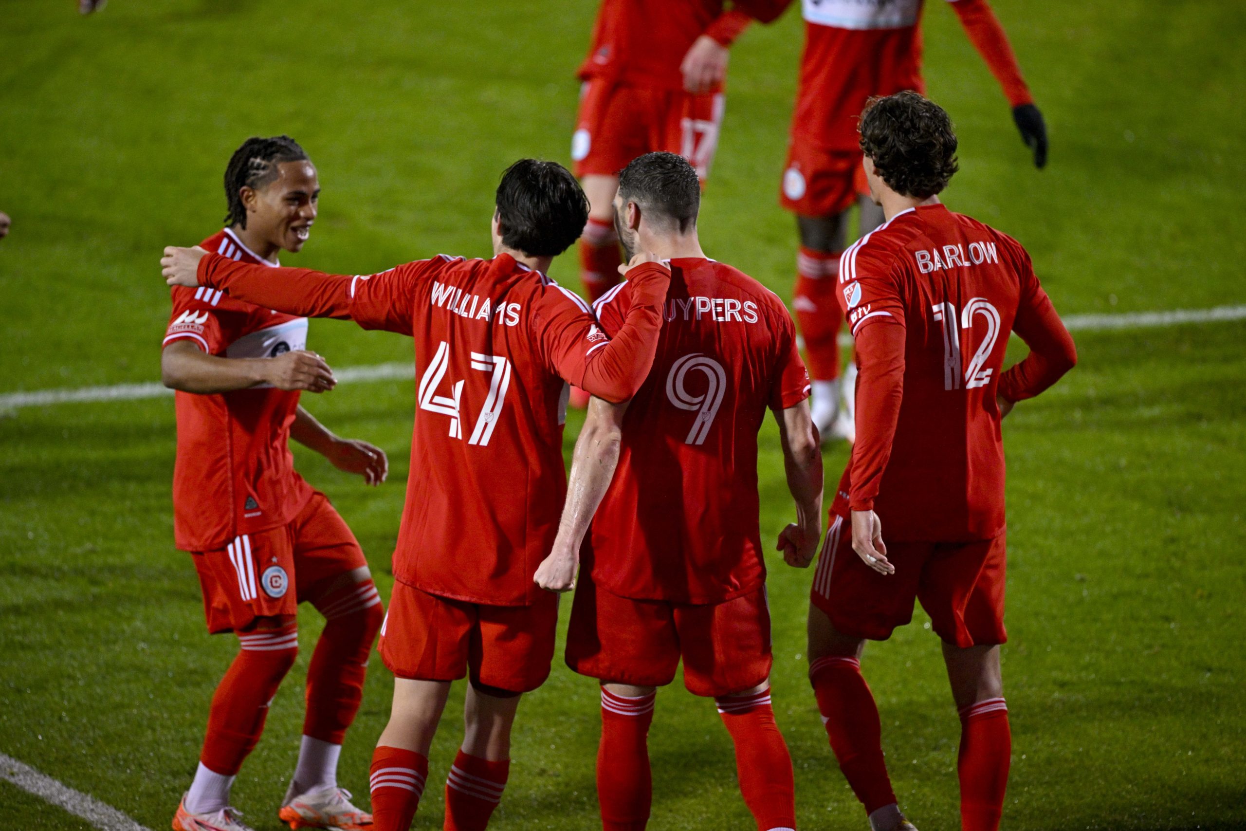 Mar 8, 2025; Frisco, Texas, USA; Chicago Fire forward Hugo Cuypers (9) and forward Tom Barlow (12) and midfielder Sam Williams (47) and defender Leonardo Barroso (2) celebrates after Cuypers scores a goal on a penalty kick against FC Dallas during the second half at Toyota Stadium.