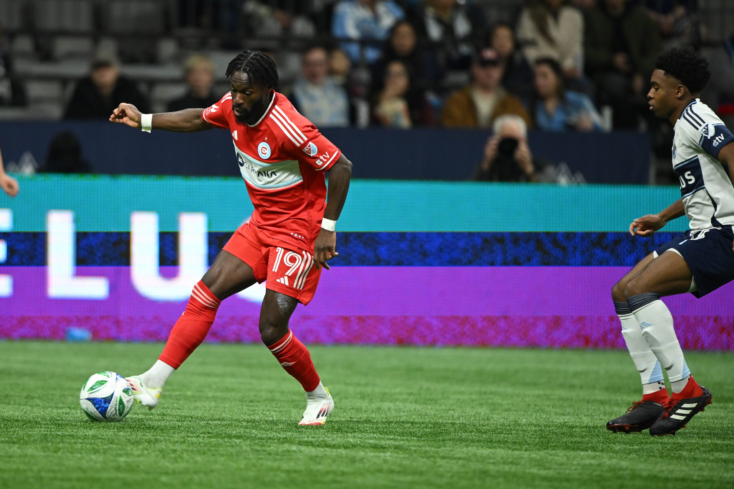 Mar 22, 2025; Vancouver, British Columbia, CAN; Chicago Fire FC forward Jonathan Bamba (19) controls the ball during the first half against the Vancouver Whitecaps FC at BC Place. Mandatory Credit: Anne-Marie Sorvin-Imagn Images