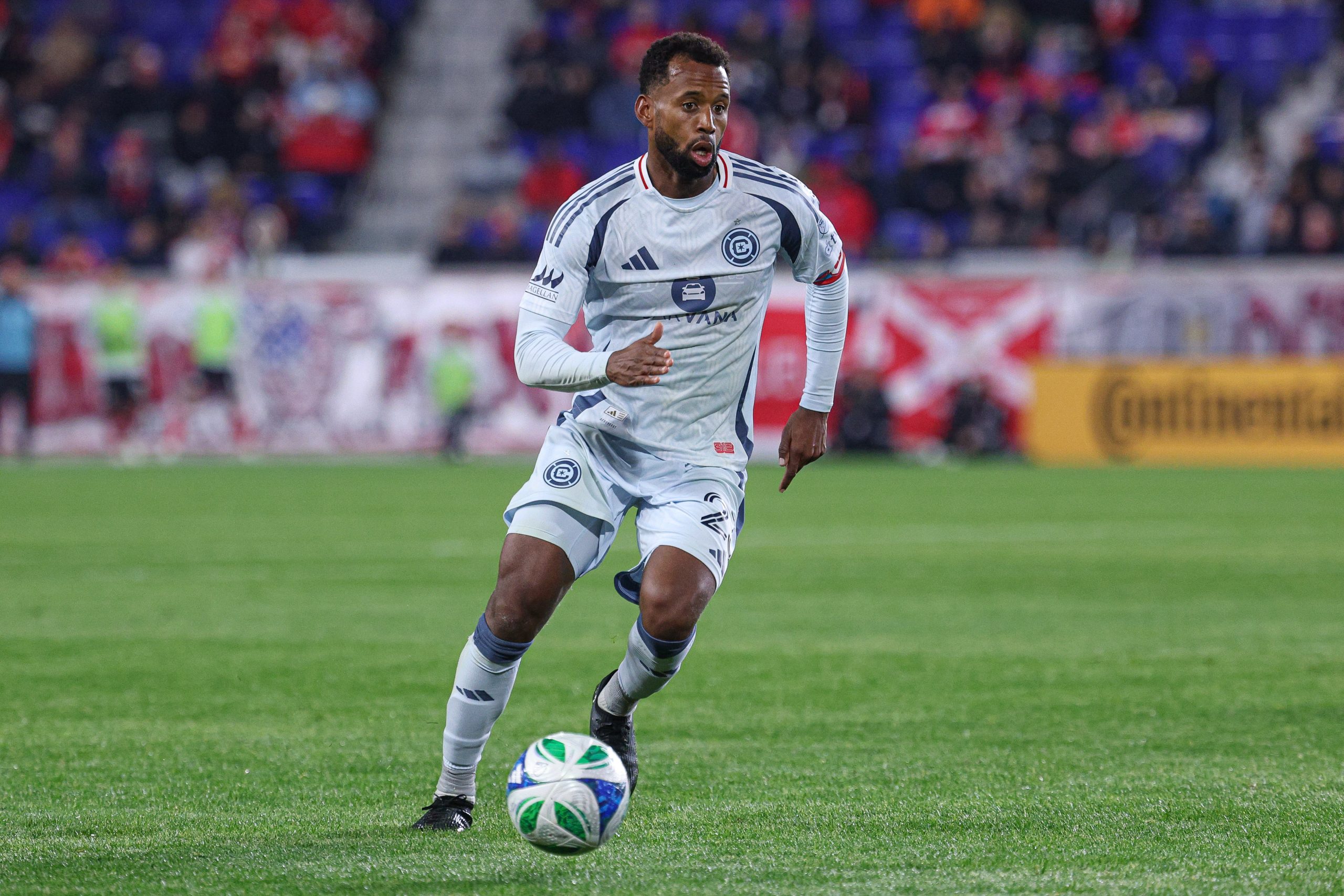 Apr 5, 2025; Harrison, New Jersey, USA; Chicago Fire FC midfielder Kellyn Acosta (23) controls the ball against the New York Red Bulls during the second half at Sports Illustrated Stadium. Mandatory Credit: Vincent Carchietta-Imagn Images