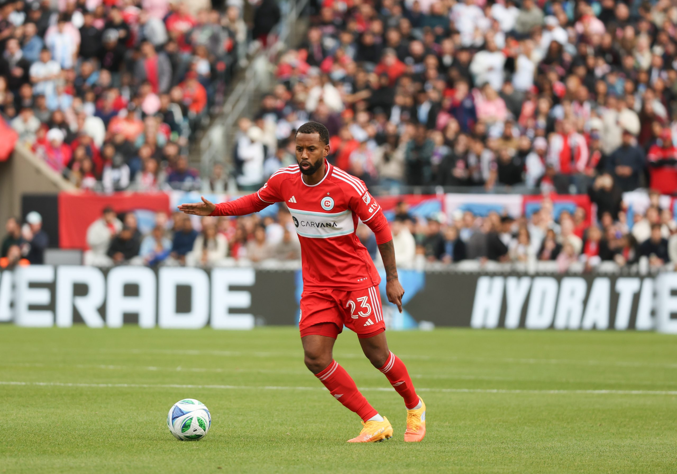 Apr 13, 2025; Chicago, Illinois, USA; Chicago Fire FC midfielder Kellyn Acosta (23) dribbles downfield during the second half against Inter Miami CF at Soldier Field. Mandatory Credit: Talia Sprague-Imagn Images