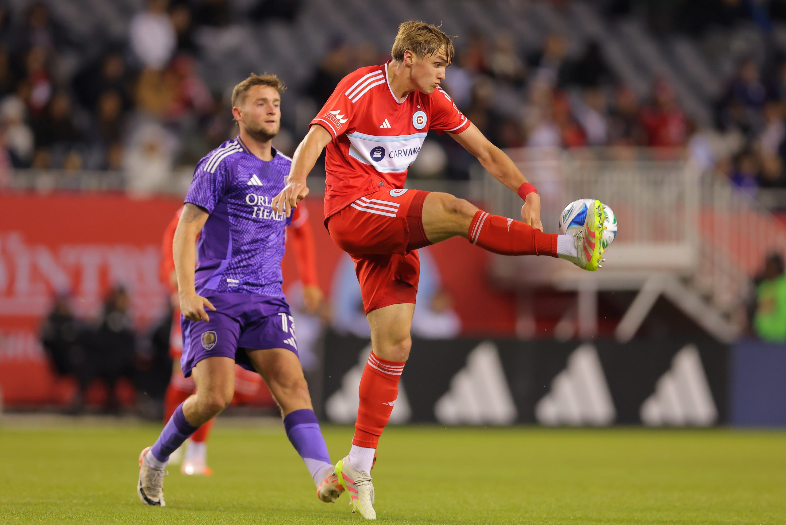 May 3, 2025; Chicago, Illinois, USA; Chicago Fire FC defender Christopher Cupps (38) controls the ball during the first half against Orlando City at Soldier Field. Mandatory Credit: Melissa Tamez-Imagn Images